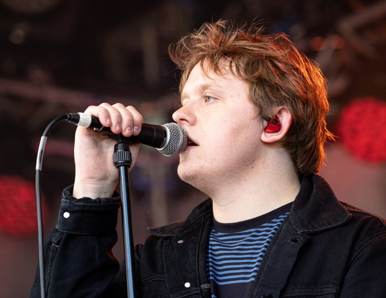man singing into microphone