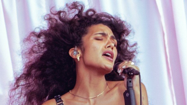 woman singing ino microphone