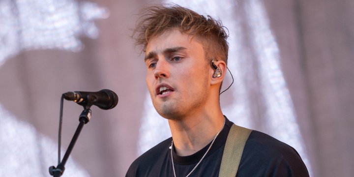 man singing into mic