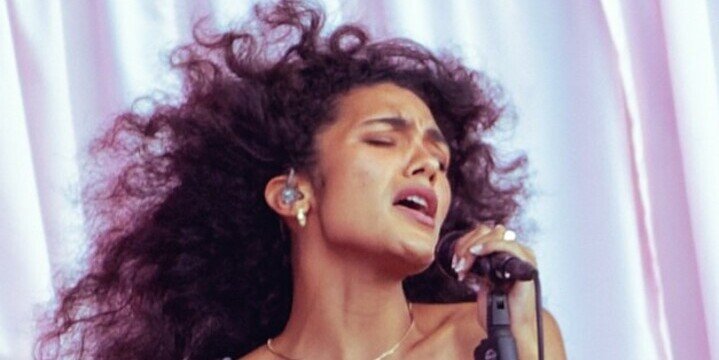woman singing into mic