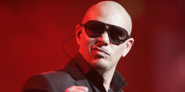 bald man with sunglasses looking at camera