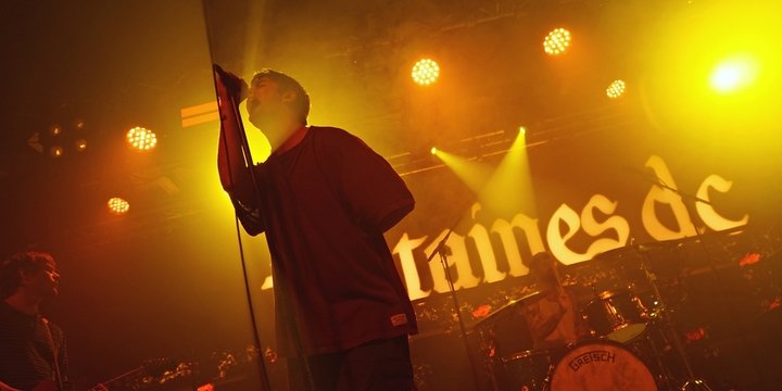 man singing into mic
