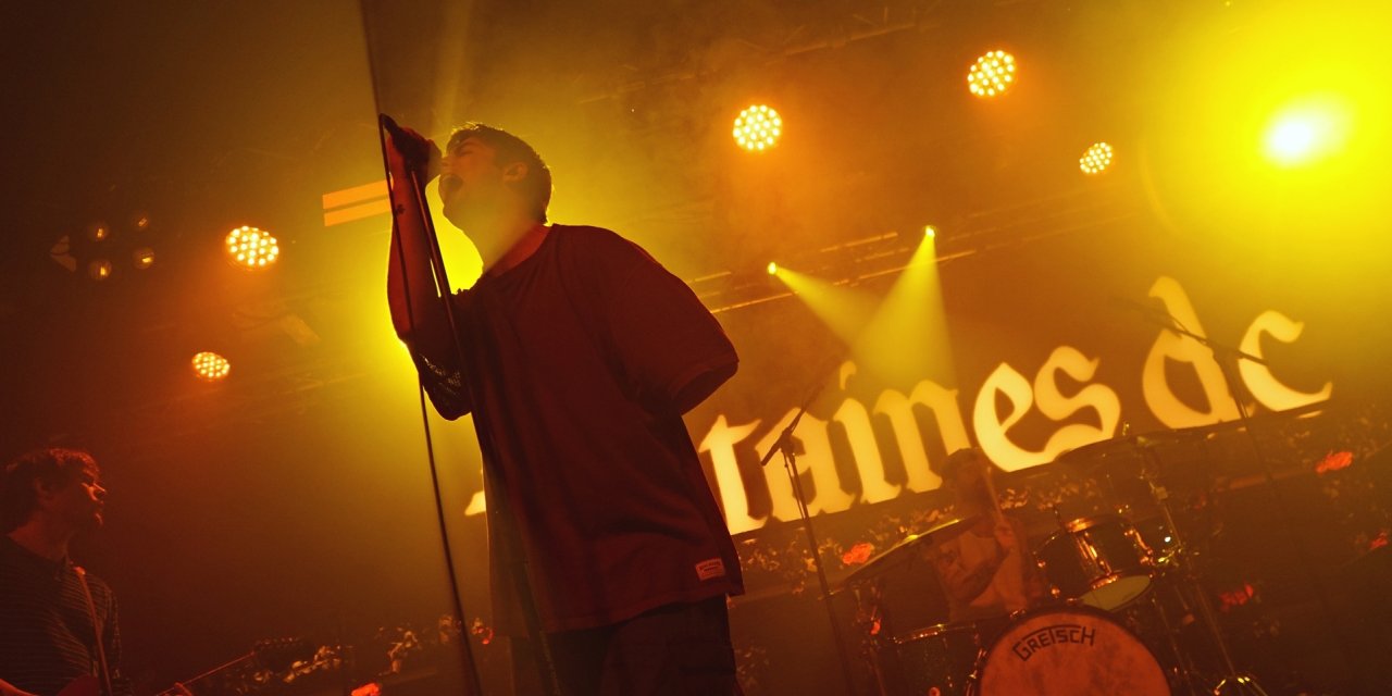 man singing into mic 