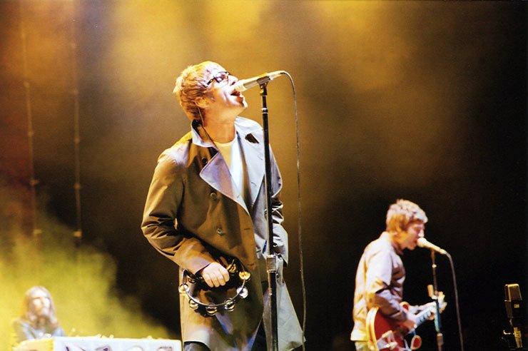 Oasis Liam and Noel Gallagher performing in concert